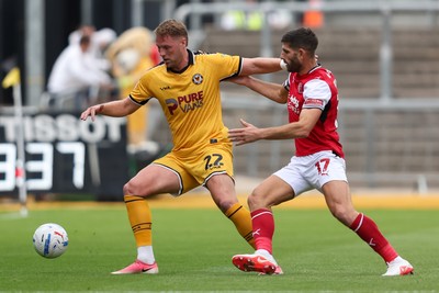 120926 - Newport County v Fleetwood Town - Sky Bet League 2 - Ched Evans of Fleetwood Town challenges Cameron Norman of Newport County for the ball