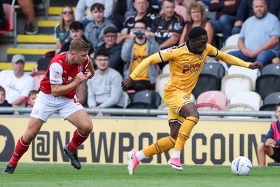 120926 - Newport County v Fleetwood Town - Sky Bet League 2 - Michael Adu-Poku of Newport County attacks with pressure from Harrison Neal of Fleetwood Town