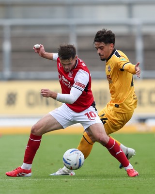 120926 - Newport County v Fleetwood Town - Sky Bet League 2 - Matt Dibley-Dias of Newport County attempts to win the ball from Mark Helm of Fleetwood Town