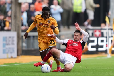 120926 - Newport County v Fleetwood Town - Sky Bet League 2 - Mark Helm of Fleetwood Town fouls Michael Adu-Poku of Newport County