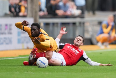 120926 - Newport County v Fleetwood Town - Sky Bet League 2 - Mark Helm of Fleetwood Town fouls Michael Adu-Poku of Newport County