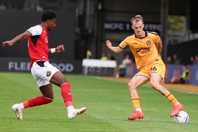 120926 - Newport County v Fleetwood Town - Sky Bet League 2 - Matty Jacob of Newport County attacks with pressure from Aaron Loupalo-Bi of Fleetwood Town