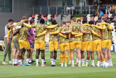 120926 - Newport County v Fleetwood Town - Sky Bet League 2 - Players of Newport County huddle before the match