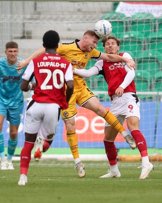 120926 - Newport County v Fleetwood Town - Sky Bet League 2 - Lee Jenkins of Newport County clears the ball from Will Davies of Fleetwood Town
