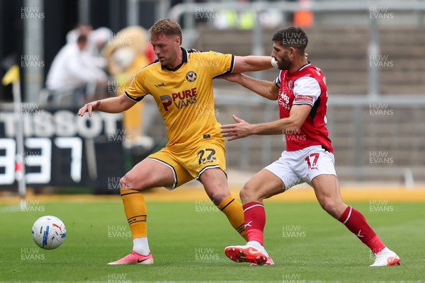 120926 - Newport County v Fleetwood Town - Sky Bet League 2 - Ched Evans of Fleetwood Town challenges Cameron Norman of Newport County for the ball