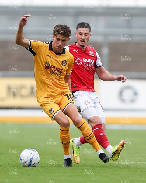 120926 - Newport County v Fleetwood Town - Sky Bet League 2 - Harrison Biggins of Newport County controls the ball with pressure from Ronan Coughlan of Fleetwood Town