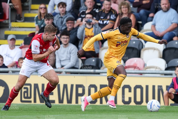 120926 - Newport County v Fleetwood Town - Sky Bet League 2 - Michael Adu-Poku of Newport County attacks with pressure from Harrison Neal of Fleetwood Town