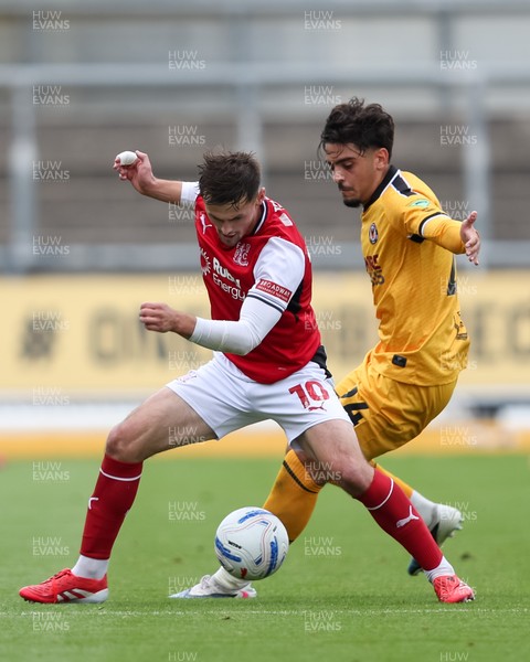 120926 - Newport County v Fleetwood Town - Sky Bet League 2 - Matt Dibley-Dias of Newport County attempts to win the ball from Mark Helm of Fleetwood Town