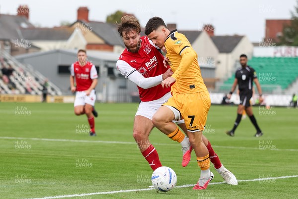 120926 - Newport County v Fleetwood Town - Sky Bet League 2 - Shaun Rooney of Fleetwood Town challenges Kieron Evans of Newport County for the ball