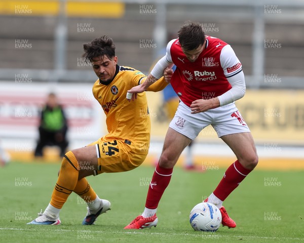 120926 - Newport County v Fleetwood Town - Sky Bet League 2 - Matt Dibley-Dias of Newport County challenges Mark Helm of Fleetwood Town for the ball