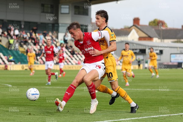 120926 - Newport County v Fleetwood Town - Sky Bet League 2 - Lewis McCann of Fleetwood Town attempts to stop Harrison Biggins of Newport County from getting to the ball