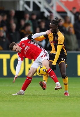 131225 - Newport County v Fleetwood Town, EFL Sky Bet League 2 - Mark Helm of Fleetwood Town and Cameron Antwi of Newport County compete for the ball