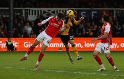 131225 - Newport County v Fleetwood Town, EFL Sky Bet League 2 - Michael Spellman of Newport County looks to head at goal as Lewis McCann of Fleetwood Town closes in