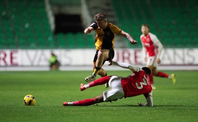 131225 - Newport County v Fleetwood Town, EFL Sky Bet League 2 - Cameron Evans of Newport County avoids the challenge from Zech Medley of Fleetwood Town