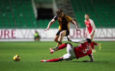 131225 - Newport County v Fleetwood Town, EFL Sky Bet League 2 - Cameron Evans of Newport County avoids the challenge from Zech Medley of Fleetwood Town