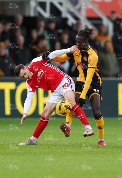 131225 - Newport County v Fleetwood Town, EFL Sky Bet League 2 - Mark Helm of Fleetwood Town and Cameron Antwi of Newport County compete for the ball