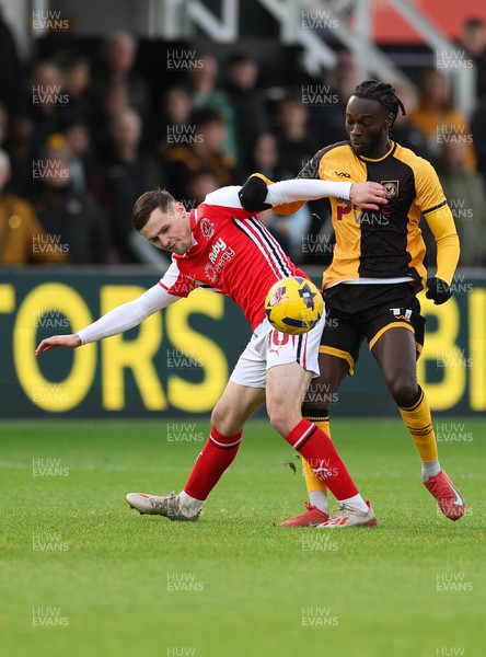 131225 - Newport County v Fleetwood Town, EFL Sky Bet League 2 - Mark Helm of Fleetwood Town and Cameron Antwi of Newport County compete for the ball