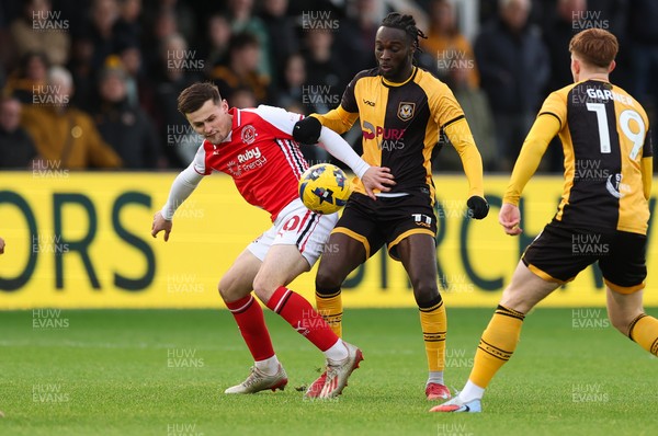 131225 - Newport County v Fleetwood Town, EFL Sky Bet League 2 - Mark Helm of Fleetwood Town and Cameron Antwi of Newport County compete for the ball