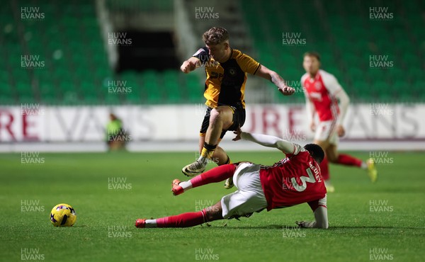 131225 - Newport County v Fleetwood Town, EFL Sky Bet League 2 - Cameron Evans of Newport County avoids the challenge from Zech Medley of Fleetwood Town