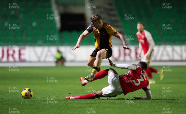 131225 - Newport County v Fleetwood Town, EFL Sky Bet League 2 - Cameron Evans of Newport County avoids the challenge from Zech Medley of Fleetwood Town