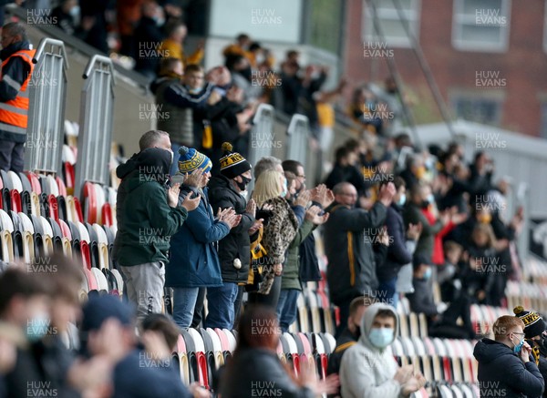 180521 - Newport County v Forest Green Rovers, Sky Bet League 2 Play Off Semi Final, First Leg - Fans in Rodney Parade applaud their team for the first time live since the pandemic started This match is one of a number of pilot events designed to allow crowds back into live events in Wales 
