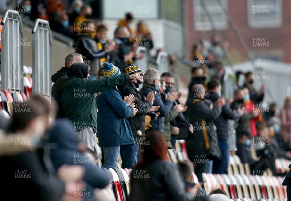 180521 - Newport County v Forest Green Rovers, Sky Bet League 2 Play Off Semi Final, First Leg - Fans in Rodney Parade applaud their team for the first time live since the pandemic started This match is one of a number of pilot events designed to allow crowds back into live events in Wales 