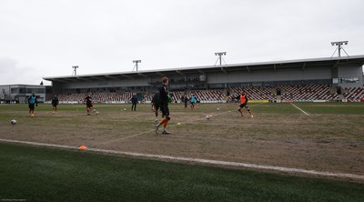 210221 Newport County v Forest Green Rovers, Sky Bet League 2 - Newport County warm up ahead of the match on a very heavy pitch