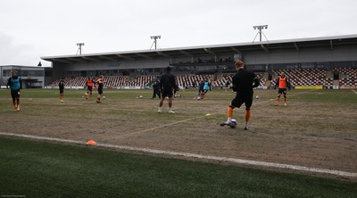 210221 Newport County v Forest Green Rovers, Sky Bet League 2 - Newport County warm up ahead of the match on a very heavy pitch