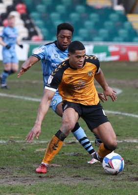 210221 Newport County v Forest Green Rovers, Sky Bet League 2 - Priestley Farquharson of Newport County holds off Ebrima Adams of Forest Green Rovers