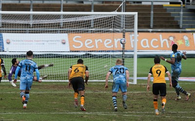 210221 Newport County v Forest Green Rovers, Sky Bet League 2 - Jamille Matt of Forest Green Rovers, right, scores the second goal as he puts the penalty shot past Newport County goalkeeper Nick Townsend
