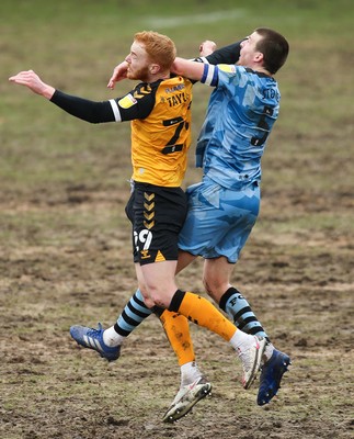 210221 Newport County v Forest Green Rovers, Sky Bet League 2 - Ryan Taylor of Newport County catches Chris Stokes of Forest Green Rovers in the face as compete for the ball