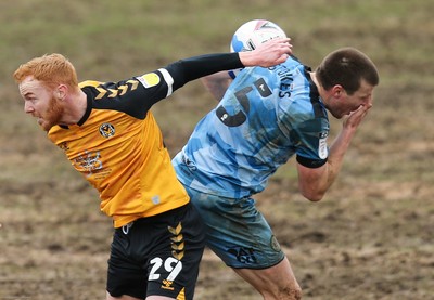 210221 Newport County v Forest Green Rovers, Sky Bet League 2 - Ryan Taylor of Newport County catches Chris Stokes of Forest Green Rovers in the face as compete for the ball