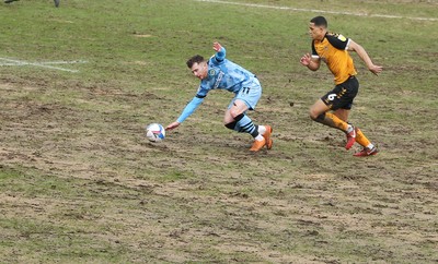 210221 Newport County v Forest Green Rovers, Sky Bet League 2 - Priestley Farquharson of Newport County and Nicholas Cadden of Forest Green Rovers compete for the ball