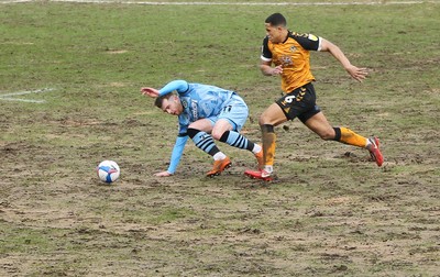 210221 Newport County v Forest Green Rovers, Sky Bet League 2 - Priestley Farquharson of Newport County and Nicholas Cadden of Forest Green Rovers compete for the ball
