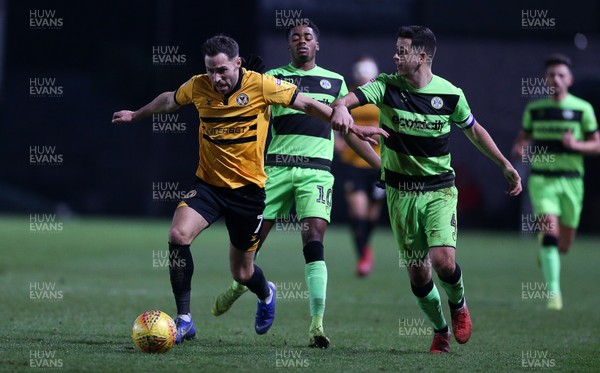 261218 - Newport County v Forest Green Rovers - SkyBet League Two - Robbie Willmott of Newport County is tackled by Lloyd James of Forest Green Rovers