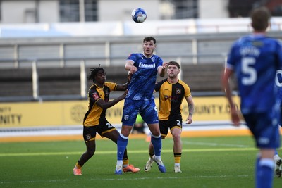 011125 - Newport County v Gillingham - FA Cup First Round - Josh Andrews of Gillingham is challenged by Habeeb Ogunneye of Newport County