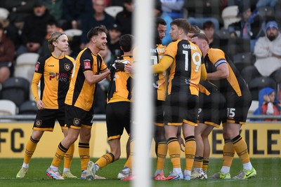 011125 - Newport County v Gillingham - FA Cup First Round - Cameron Evans of Newport County celebrates scoring a goal with team mates