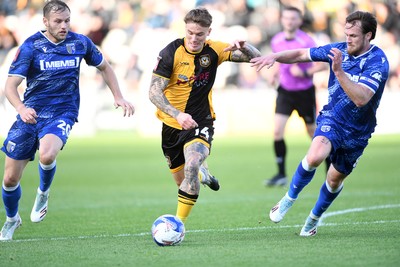 011125 - Newport County v Gillingham - FA Cup First Round - Kai Whitmore of Newport County is challenged by Elliott Nevitt of Gillingham