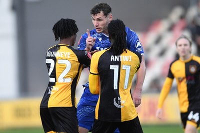 011125 - Newport County v Gillingham - FA Cup First Round - Josh Andrews of Gillingham has a disagreement with Habeeb Ogunneye of Newport County and Cameron Antwi of Newport County