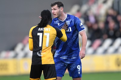 011125 - Newport County v Gillingham - FA Cup First Round - Josh Andrews of Gillingham has a disagreement with Cameron Antwi of Newport County