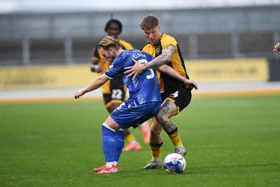 011125 - Newport County v Gillingham - FA Cup First Round - Kai Whitmore of Newport County is challenged by Max Clark of Gillingham