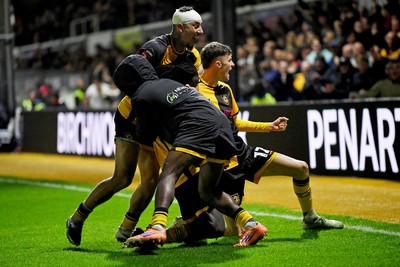 011125 - Newport County v Gillingham - FA Cup First Round - Cameron Antwi of Newport County celebrates scoring a goal with team mates