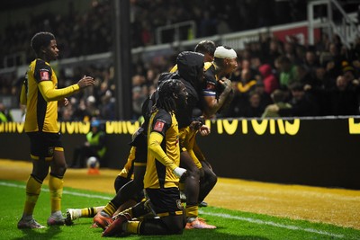 011125 - Newport County v Gillingham - FA Cup First Round - Cameron Antwi of Newport County celebrates scoring a goal with team mates
