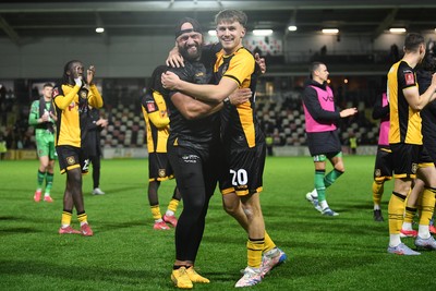 011125 - Newport County v Gillingham - FA Cup First Round - Ben Lloyd of Newport County celebrates after scoring the winning penalty with David Pipe