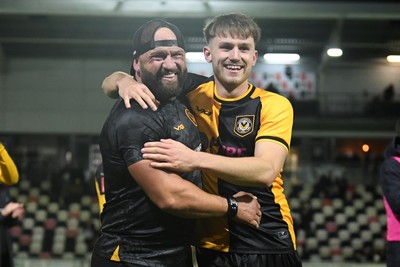 011125 - Newport County v Gillingham - FA Cup First Round - Ben Lloyd of Newport County celebrates after scoring the winning penalty with David Pipe