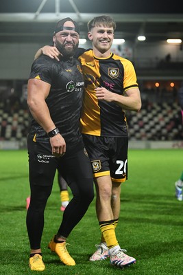 011125 - Newport County v Gillingham - FA Cup First Round - Ben Lloyd of Newport County celebrates after scoring the winning penalty with David Pipe