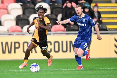 011125 - Newport County v Gillingham - FA Cup First Round - Habeeb Ogunneye of Newport County is challenged by Max Clark of Gillingham