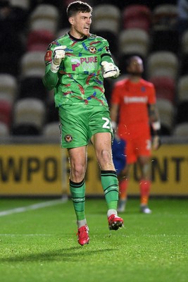 011125 - Newport County v Gillingham - FA Cup First Round - Jordan Wright of Newport County celebrates after he saves a penalty