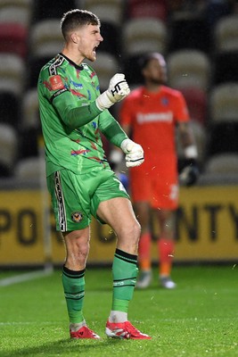 011125 - Newport County v Gillingham - FA Cup First Round - Jordan Wright of Newport County celebrates after he saves a penalty