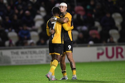 011125 - Newport County v Gillingham - FA Cup First Round - Bobby Kamwa of Newport County celebrates with Courtney Baker-Richardson of Newport County after scoring his penalty